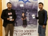 two-men-next-to-poster