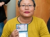 woman-in-yellow-with-id-card